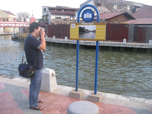 Swiss taking a picture of Jeremy taking a picture of the photo shot sign in front of the actual object