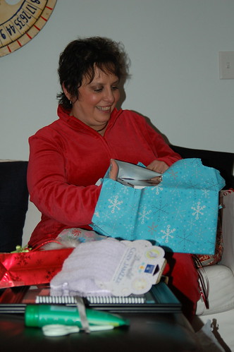 Phyllis opening her gift.