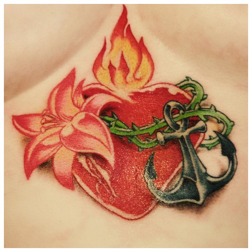 Flaming black heart tattoo. Rose tattoo design with black heart.