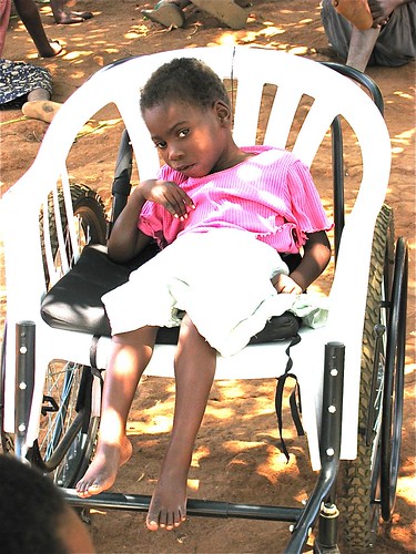 6 year old Judith, a malaria victim, receives her new wheelchair.