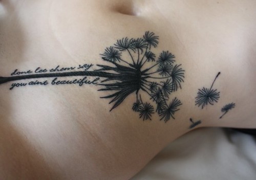my 2nd tattoo, a dandelion, with lyrics sayin "dont let them say you ant 
