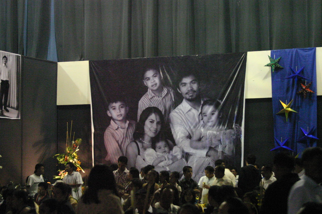 "A GIANT TARP OF THE PACQUIAO FAMILY HANGS ON THE WALL OF THE HALL"