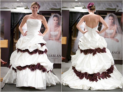 This strapless dresses features dark red flowers that are slipped in between