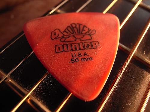 Red colored guitar pick