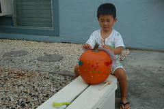 Owen decorating his pumpkin