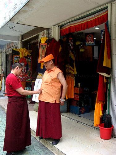 Tibetan monks grooming each other