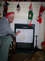 baldman warming his hands by the fire