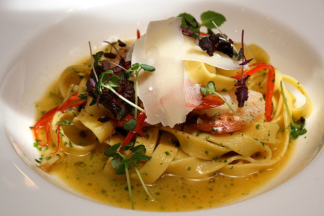 Tagliatelle with Fresh Tiger Prawns, sauteed with garlic, chillies and anchovies, topped with Parmigiano cheese shavings