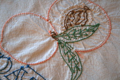 Embroidered teal towel, peach back