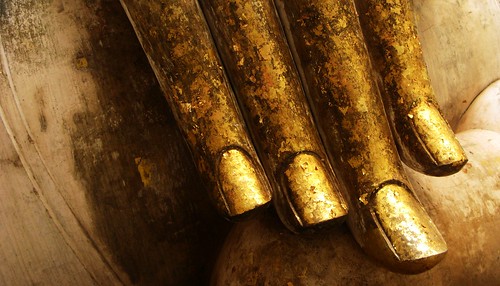Gold leafed fingers of Buddha - Sukhothai, Thailand
