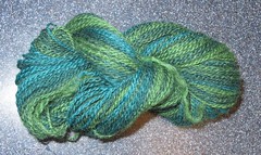 The yarn spun from a 3-color striped batt.