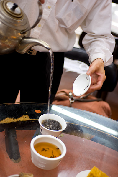 Pouring tea at Lin Heung Tea House, a dim sum restaurant in Hong Kong