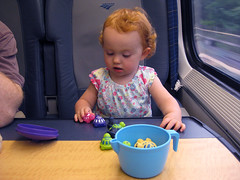 playing with plastic turtles on the Acela train