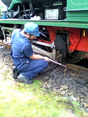Driver checking the oil in the ABT Locomotive