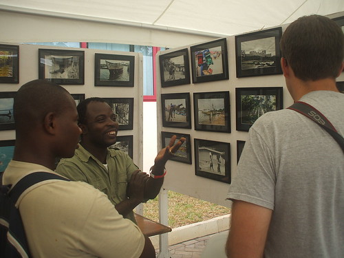Nana Kofi Acquah in a friendly chat with some visitors to his booth