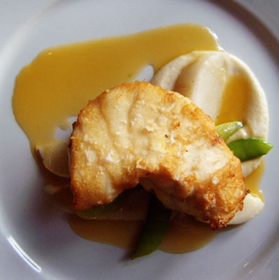 Monkfish with apples flavored butter sauce and cauliflower puree
