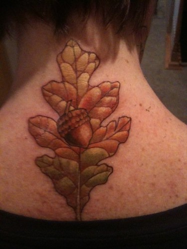 Oak leaf with acorn back neck tattoo. Oak leaf tattoo done by Johnny at Skin 