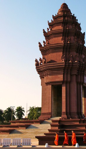 Monks circumabulate Independence Monument at sunset - Phnom Penh, Cambodia