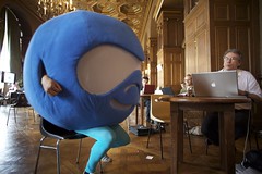 Photo of Druplicon sitting for a Job interview at the Job fair