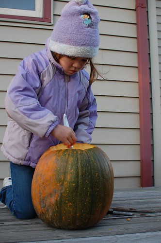 Hannah scooping out her pumpkin