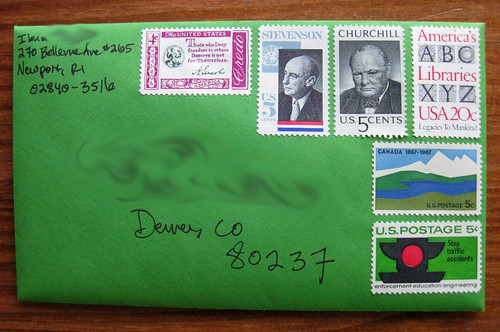 Vintage stamps on green envelope