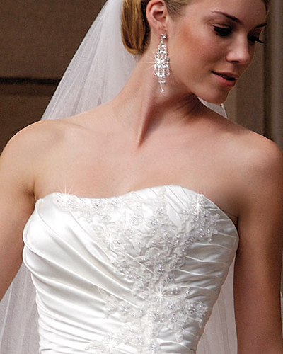 Wedding gown with a headdress and a long tail