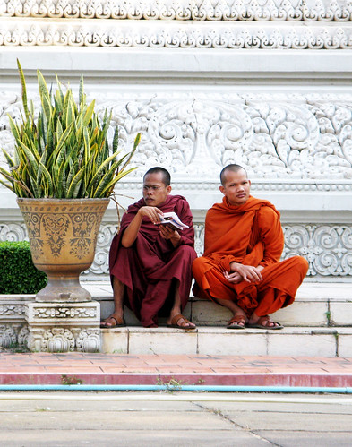 Even monks' feet get sore after a long day of touring at Royal Palace - Phnom Penh, Cambodia