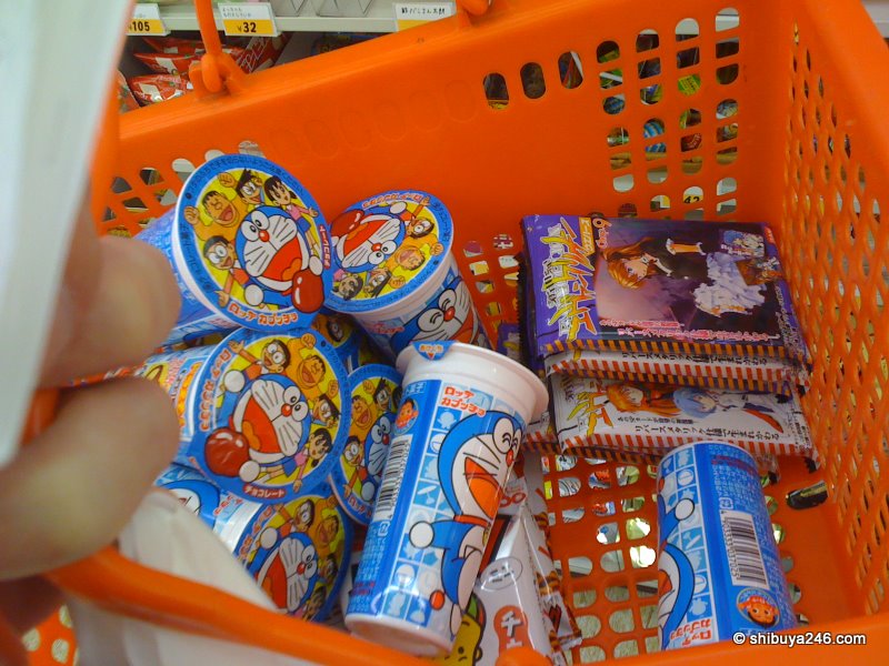 Lots of Doraemon snacks and some EVA cards going into the Conbini Box.
