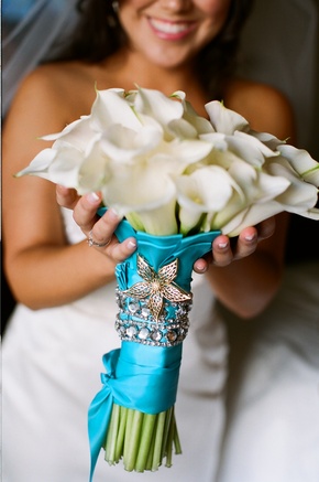 Most popular ways are to wrap your flowers with a swathe of blue satin to 