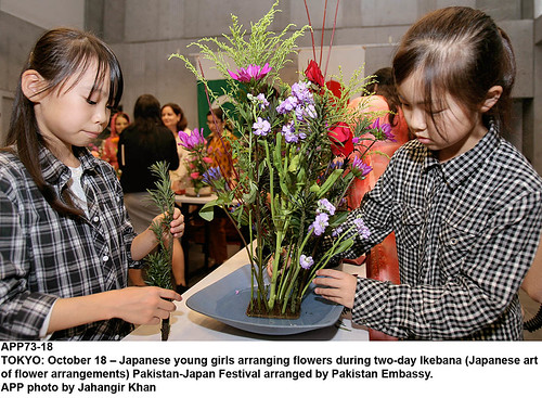 japanese art flowers. Japanese young girls arranging flowers during two-day Ikebana (Japanese art