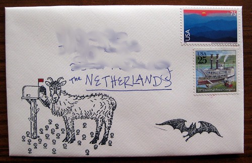 Goat eats mail stamp