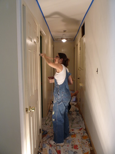 Amy painting the walls in the hallway. by you.