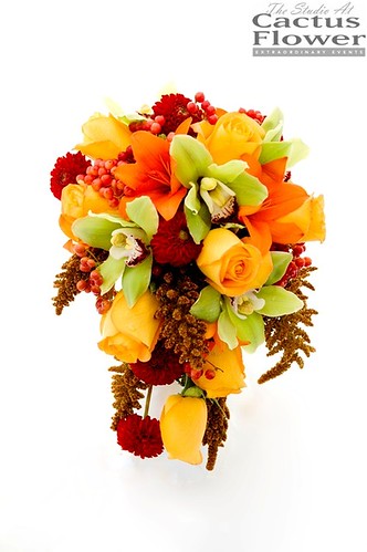 Here's a lovely fall wedding bouquet cascading with roses and orchids and