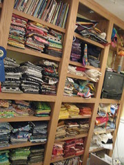 fabric neatly stacked on the shelves