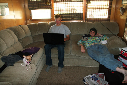 Adam relaxes while Andreas plays on his computer