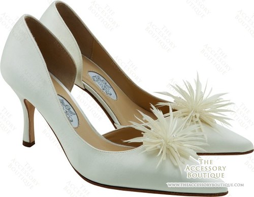 The feathers in wedding shoes touch.
