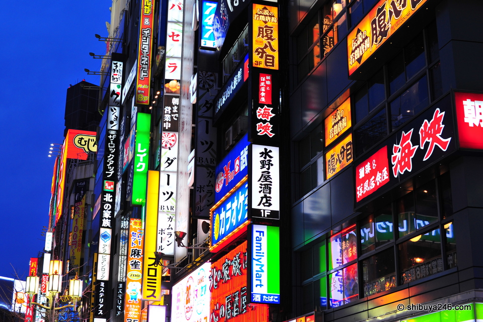 The Shinjuku neon glows bright.