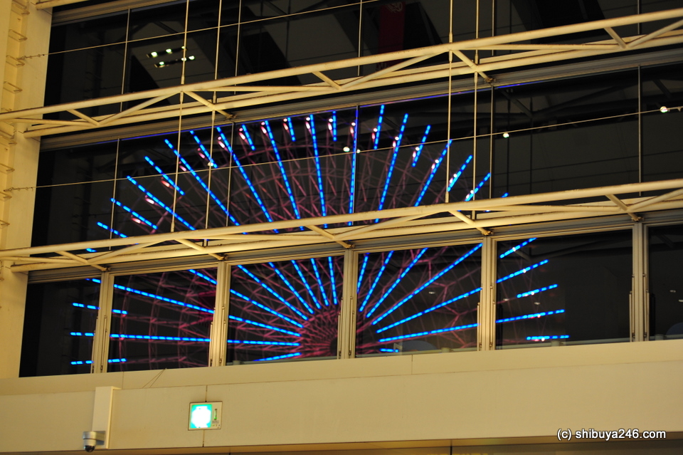 The Ferris Wheel seen from inside the Queen's Square shopping mall.