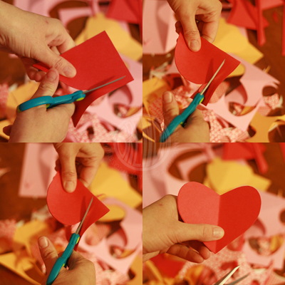 cutting a paper heart