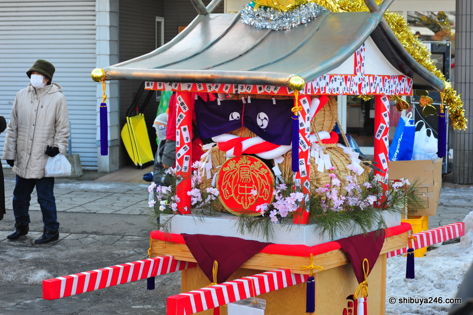 A portable shrine getting ready to be shown in the parade.