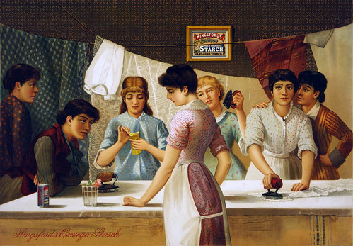 image of women standing around ironing tables, working and talking