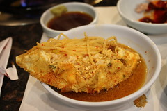 Rice stuffed into the crab with sprouts