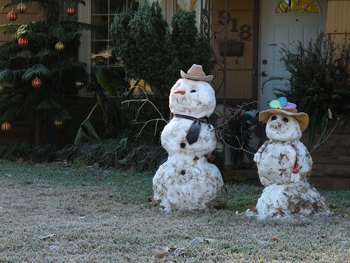 Houston Texas Winter Snow Two snowmen standing in yard  December 4 2009 during and after the snow fall  IMG_2246