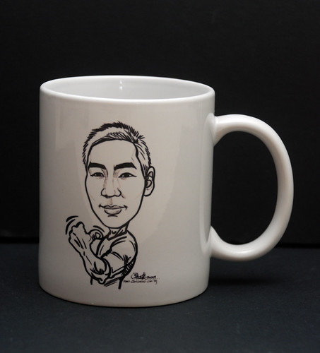 guy caricature in ink on mug