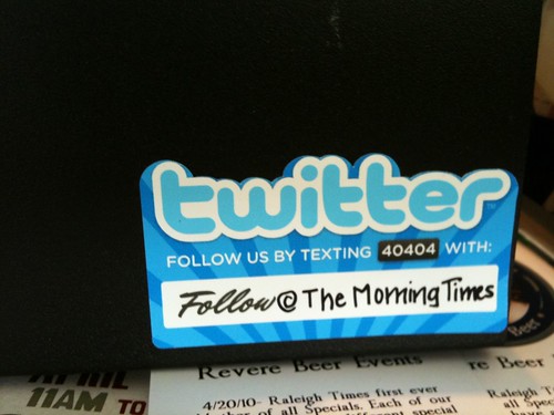 How Morning Times promoting their Twitter account on the cash register