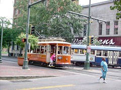 Orange 4 wheel Gomaco replica trolley. The Memphis Main Street Trolley. Memphis Tennesee. September 2007.