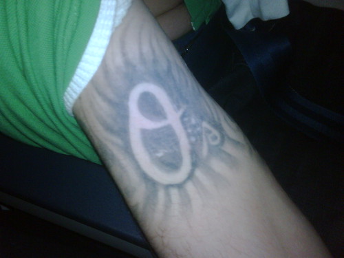 steelers logo tattoo. an Orioles logo tattoo.