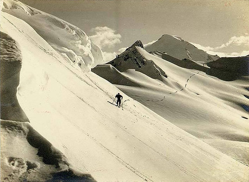 Skier traveling past Coleman Creek and Camp Kizer, Mount Baker