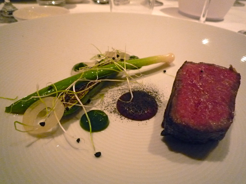 Wagyu sirloin with black olive, Earl Grey ash, burnt cucumber and onion