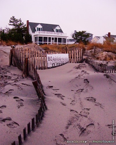 Newly deposited sand placed by a nor'easter obscures a footpath from the beach to homes nearby at Rehoboth Beach, Delaware, USA.